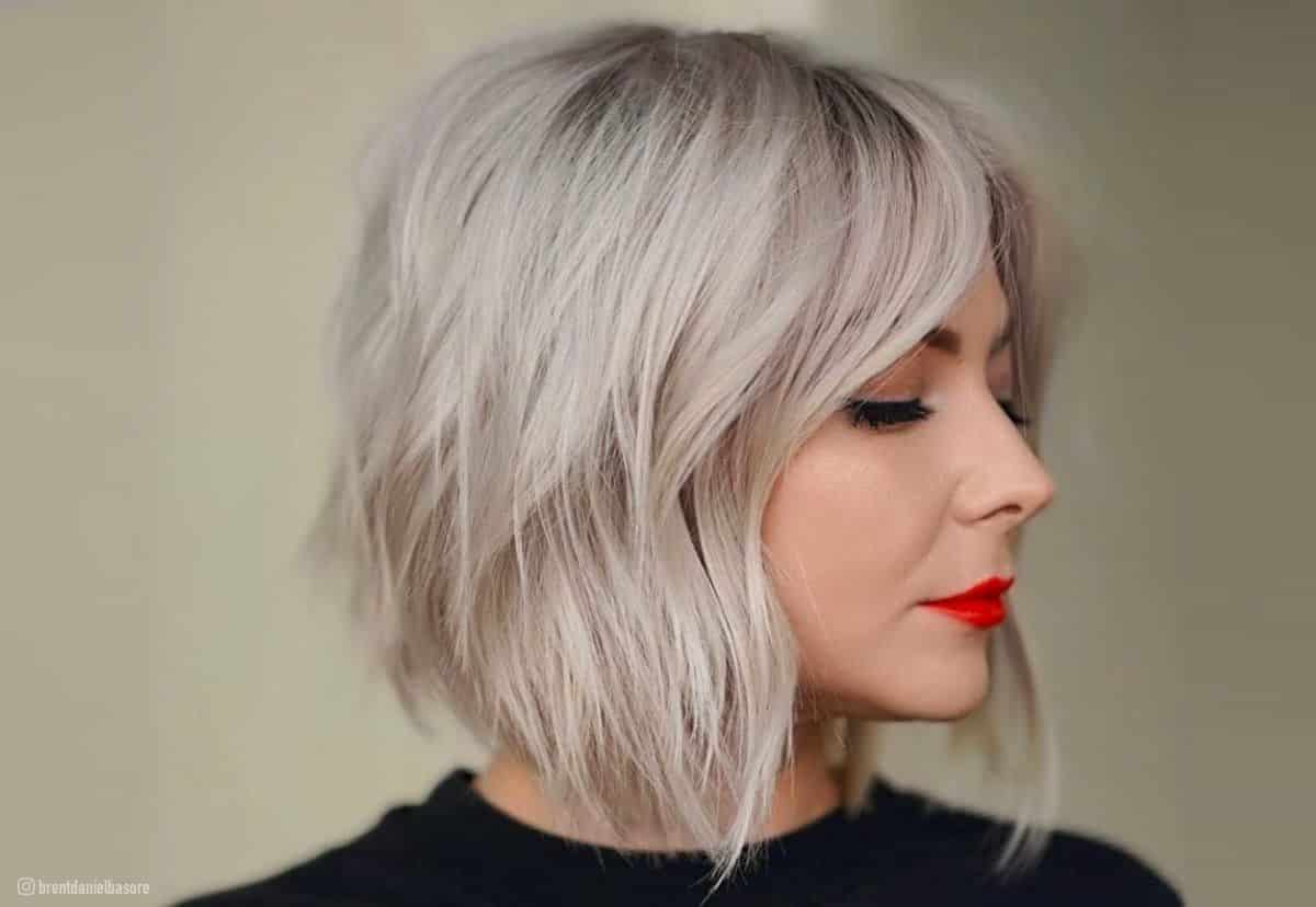 Pastel lavender hair style, soft wavy look inspired by celebrities like Hilary Duff and Kylie Jenner