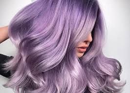Pastel lavender hair style, soft wavy look inspired by celebrities like Hilary Duff and Kylie Jenner